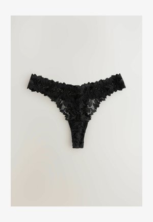 Zwarte kanten string met bloemmotieven, golvende randen en een sheer textuur, ontworpen met een minimale bedekking aan de achterkant en een delicate tailleband.