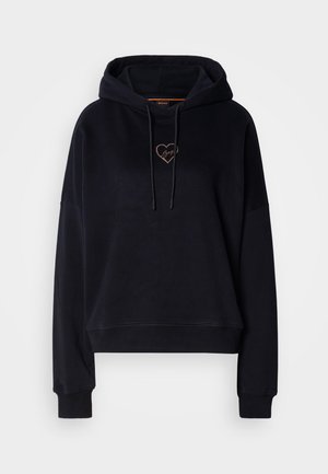 Sudadera negra con un corte relajado, capucha con cordones y un pequeño bordado de corazón en color cobre. Presenta puños acanalados y una textura suave.