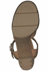 Beige sandaler med en struktureret overdel, justerbar rem og gummisål med en let hæl. Bemærkelsesværdigt logo prægede på sålen.
