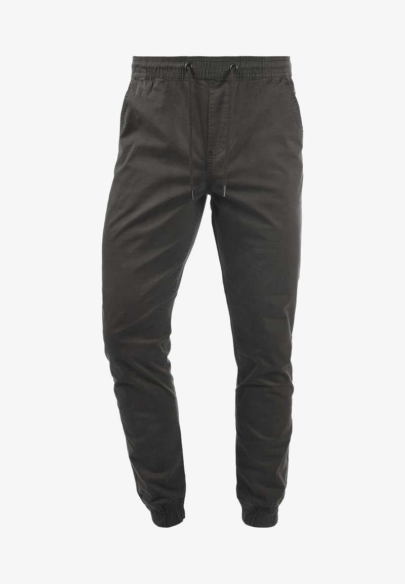 Pantalon de jogging noir avec taille élastique et cordon, jambes fuselées, poches latérales et poignets élastiques.