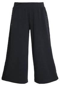 Black wide-leg pants made from soft fabric, featuring side pockets and a comfortable elastic waistband; embossed logo along the side.