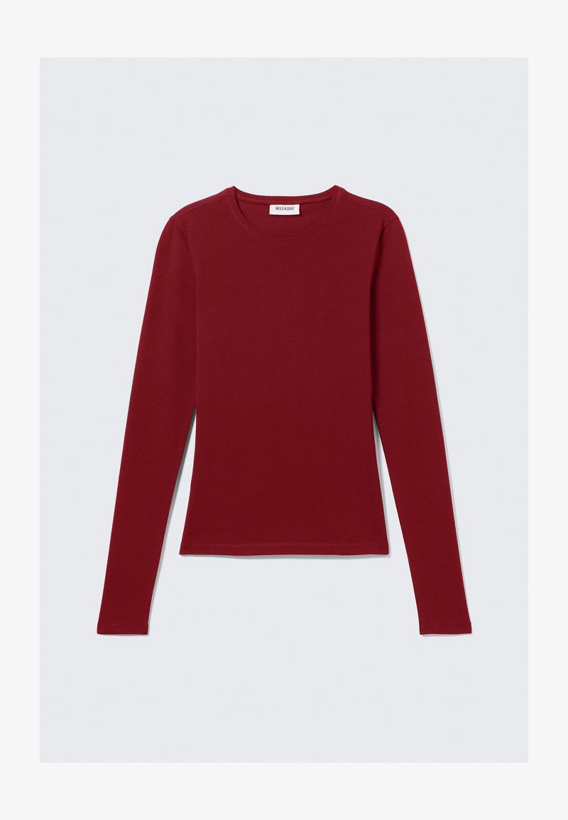 Maglietta a maniche lunghe, con collo rotondo, di colore bordeaux solido, distesa su uno sfondo bianco, senza motivi visibili o loghi.