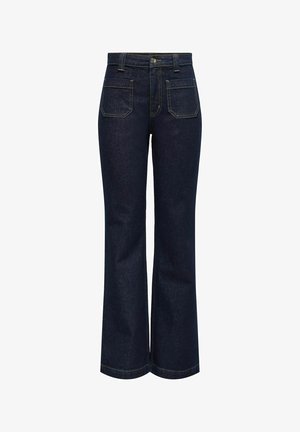 Jeans de mezclilla oscuros acampanados con cintura alta, que cuentan con dos bolsillos traseros y costuras y bordes en amarillo contrastante.