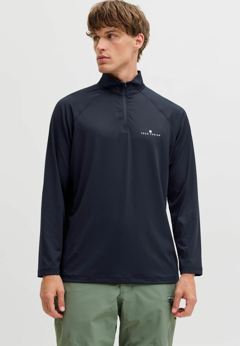 Must musta varrukatega pullover kõrge kaelusega ja pool-zipiga. Kerge kangas, millel on rindkere peal logo ja raglan varrukad.