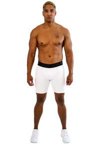 Culotte bianche aderenti con un elastico nero in vita con il logo "STARK SOUL". Design semplice, texture liscia, forma aderente.