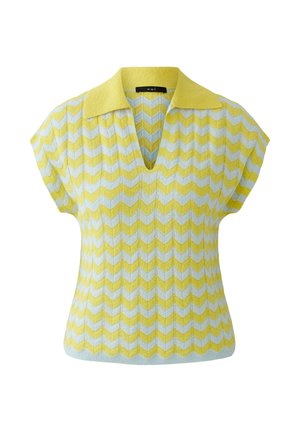 Gelb-weißes Chevron-Strick-Ärmelloses Top mit umgeschlagenem Kragen und V-Ausschnitt.