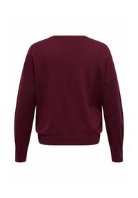 Bordowy sweter o luźnym kroju, z opadającymi ramionami, ściągaczami przy mankietach i u dołu. Wykonany z miękkiego materiału o gładkiej fakturze i minimalnymi szwami.