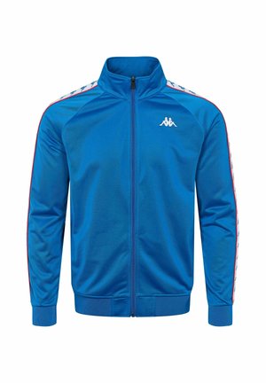 Modra športna jopa z zadrgo iz gladkega blaga. Ima stoječi ovratnik, rebraste manšete in bočne črte z logotipom na prsih.