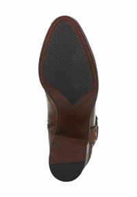 Chaussure en cuir marron avec une tige lisse, un orteil carré et une semelle en caoutchouc dotée d'un motif texturé pour une meilleure adhérence. Comprend un détail de boucle décoratif.