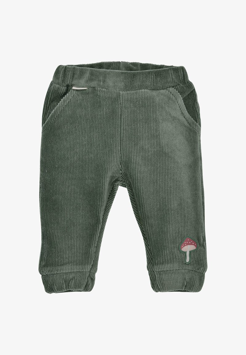 Grüne Cordhosen mit elastischem Bund, zwei seitlichen Taschen und einem Pilz-Patch-Detail am unteren linken Bein. Weicher Stoff, taillierte Passform.
