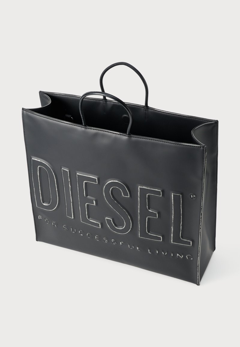 Borsa tote in pelle nera con logo embossed "DIESEL PER UNA VITA DI SUCCESSO", forma rettangolare, doppie maniglie superiori e texture liscia.