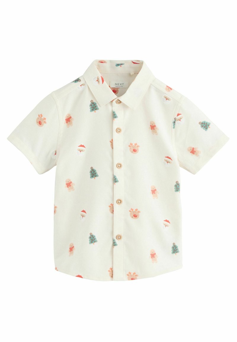 Kurzärmliges Hemd in Creme mit einem Allover-Print von Santa, Rentieren, Lebkuchen und Weihnachtsbäumen in Pastellfarben.