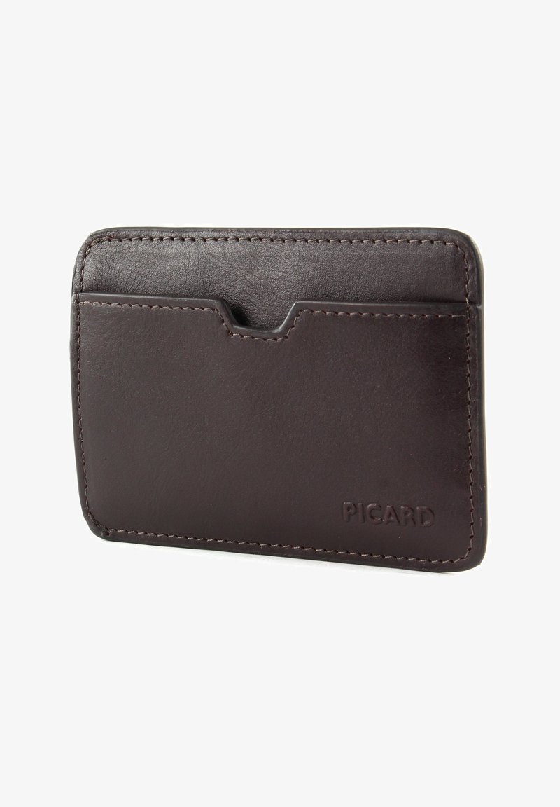 Brown leather cardholder with a smooth texture, rounded edges, and a front slot. Features visible stitching and a logo on the bottom right.