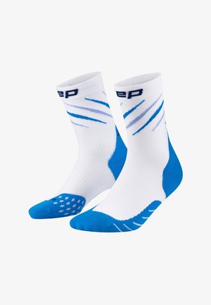 White athletic socks featuring blue accents, striped design, and textured sole with grip dots. Reinforced heels and toes for durability.