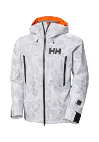 Veste camouflée blanche avec des zips et des accents noirs. La capuche est dotée d'un doublure orange. Deux poches avant zippées et logo visible.
