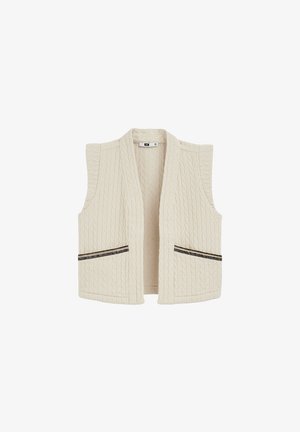 Gilet trapuntato crema senza maniche con apertura frontale e due tasche frontali con dettagli di cerniere nere.