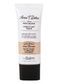 Crema idratante colorata in tubo squeezable. Corpo bianco con dettagli marroni e base nera. Presenta il nome del prodotto e note di sostenibilità in testo nero.