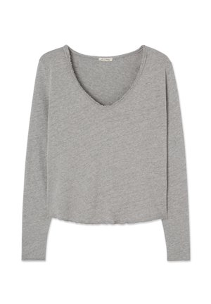 Grå langermet topp i myk stoff med dyp V-hals, rå kanter, kort design og avslappet passform.