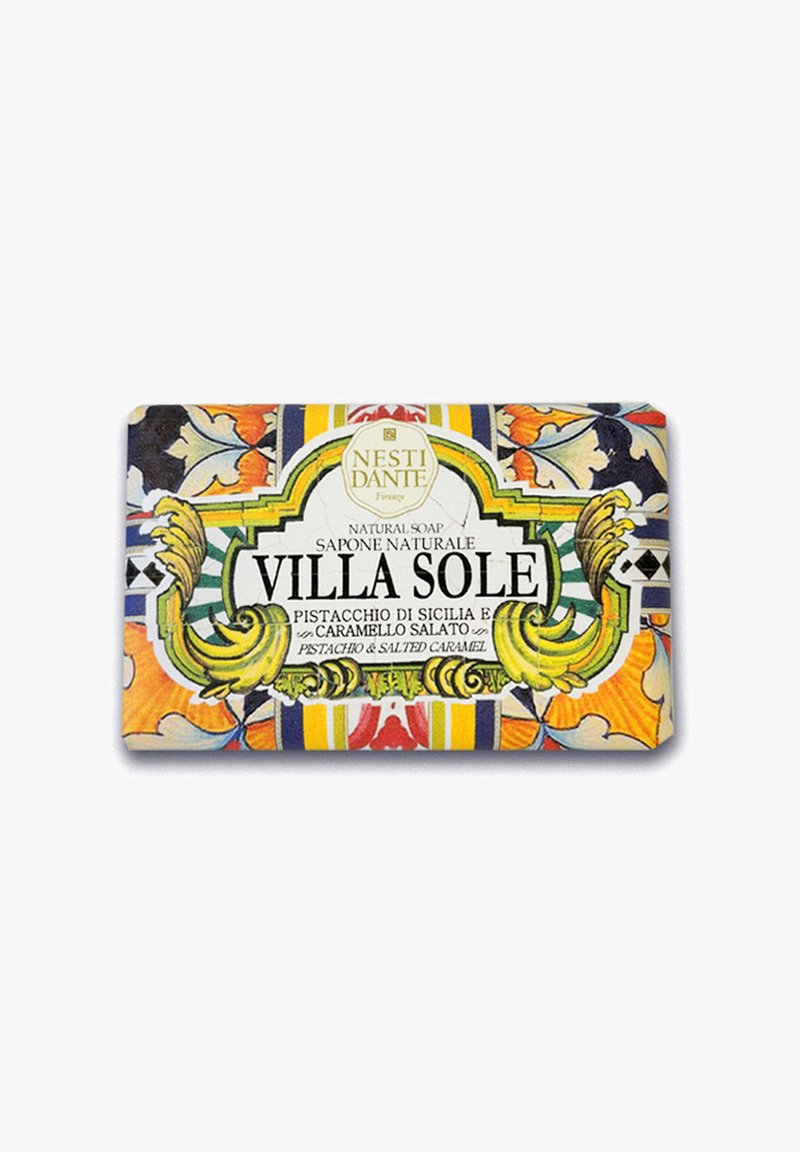 Natural soap bar with colorful floral and geometric pattern. Features a label reading "VILLA SOLE" and notes of pistachio and salted caramel.