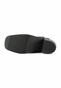 Black leather shoe sole with a textured surface, featuring horizontal and vertical grooves for grip. Lightweight and flexible design.