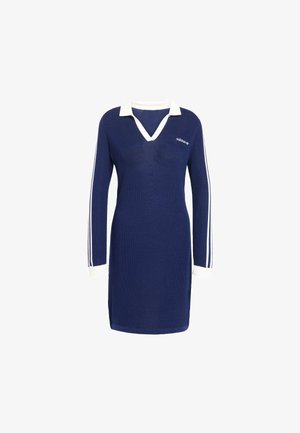 Marine gebreide jurk met witte kraag en manchetten. Heeft witte strepen langs de mouwen en een geborduurd logo op de borst.