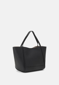 Black leather tote bag with a structured shape, smooth texture, long handles, and a subtle seam detail along the base.