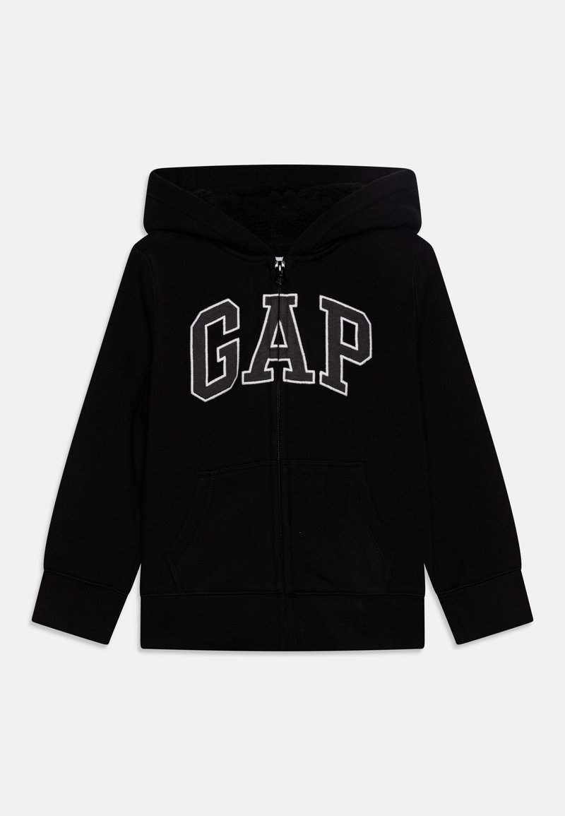 Sweat à capuche noir zippé avec poches avant, doté d'une capuche et d’un large lettrage blanc "GAP" sur la poitrine.