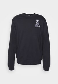 Felpa nera in cotone, con collo rotondo e maniche lunghe. Sul fronte è presente un logo ricamato bianco con un design di sole e arcobaleno.