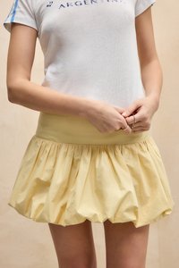 Yellow, gathered, bubble skirt with a wide waistband; made of lightweight fabric, features a smooth texture and a voluminous silhouette.