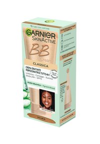 Tubo di crema BB in una scatola beige e verde. I dettagli notevoli includono una texture leggera, SPF 15 e ingredienti idratanti con una tonalità scura.