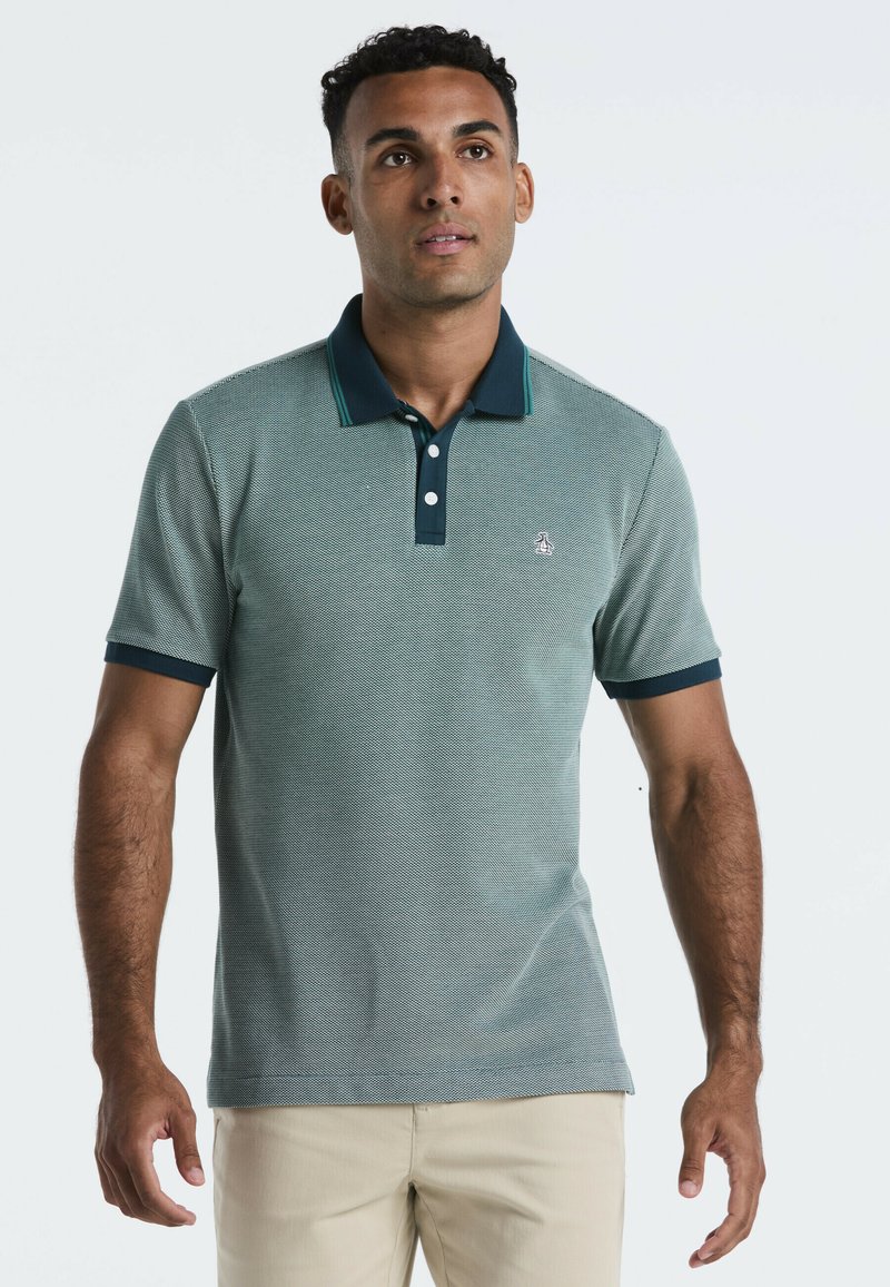 Polo shirt met korte mouwen in een gestructureerd groen en marineblauw ontwerp, met een effen marineblauwe kraag, een drie-knopen sluiting en een logo op de borst.