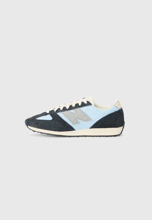 Men's sneakers featuring a black suede and light blue textile design. Rubber sole, lace-up front, and a gray logo accent on the side.