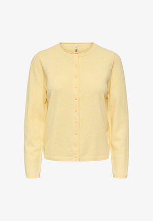 Cardigan giallo con bottoni realizzato in tessuto morbido e strutturato. Presenta una scollatura rotonda, maniche lunghe e una fila di bottoni abbinati.