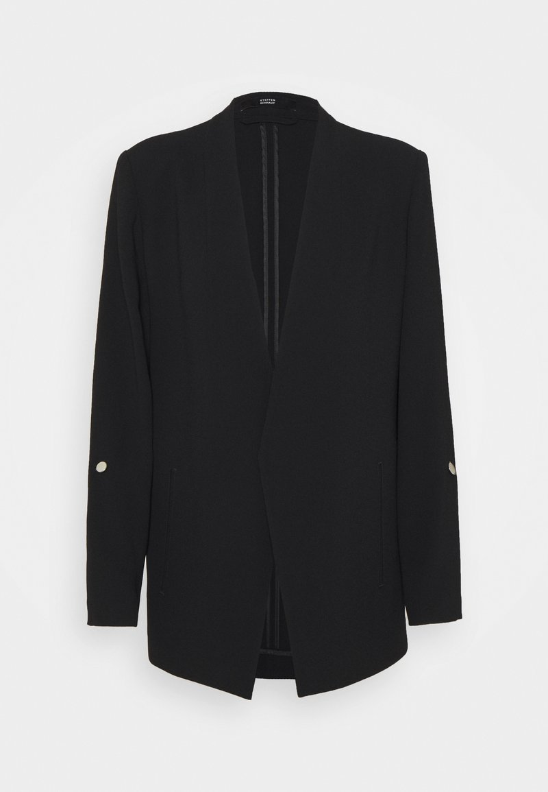 Blazer portefeuille noir en tissu lisse, avec manches longues ornées de boutons argentés et ouverture sur le devant.
