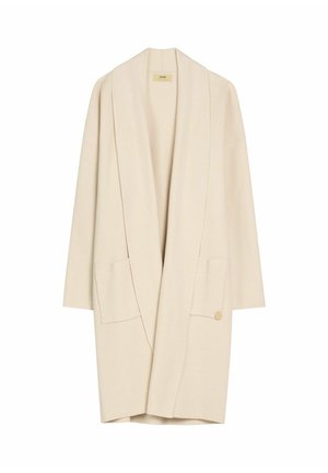 Długi kremowy kardigan z otwartym przodem, szerokimi klapami, dwoma przednimi kieszeniami i luźnym krojem.