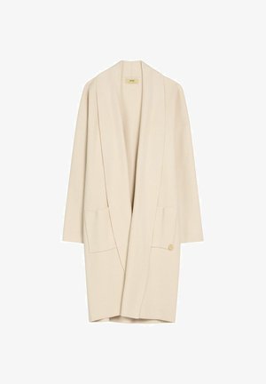 Długi kremowy kardigan z otwartym przodem, szerokimi klapami, dwoma przednimi kieszeniami i luźnym krojem.