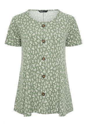 Groene korte mouw blouse met ronde hals, witte bloemenprint en vijf bruine knopen middenvoor.