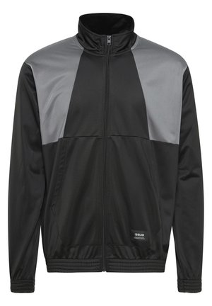 Schwarze Zip-Jacke mit grauen Panelakzenten, hohem Kragen und elastischen Bündchen. Sie verfügt über einen glatten, leichten Stoff und zwei seitliche Taschen.