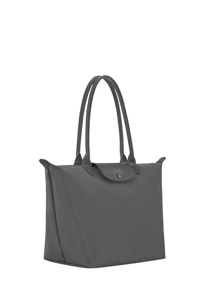 Large gray tote bag with long handles and a small flap with snap button closure on the top center.
