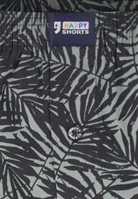 Zwarte en grijze tropische bladerenpatroon shorts met een elastische tailleband. Heeft een voorknoop met de tekst "HAPPY SHORTS". Lichtgewicht stof.