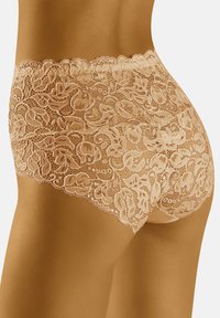Kanten bikini slipjes in een lichte beige tint, met een golvende tailleband en bloemmotief, zachte textuur en een middelhoge snit.