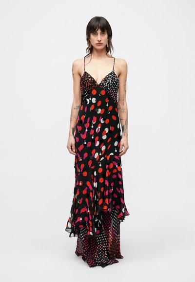 Maxikleid mit schwarzem Hintergrund, versehen mit großen roten, rosa und weißen Punkten. Spaghettiträger und ein fließender Saum. Weicher Stoff.