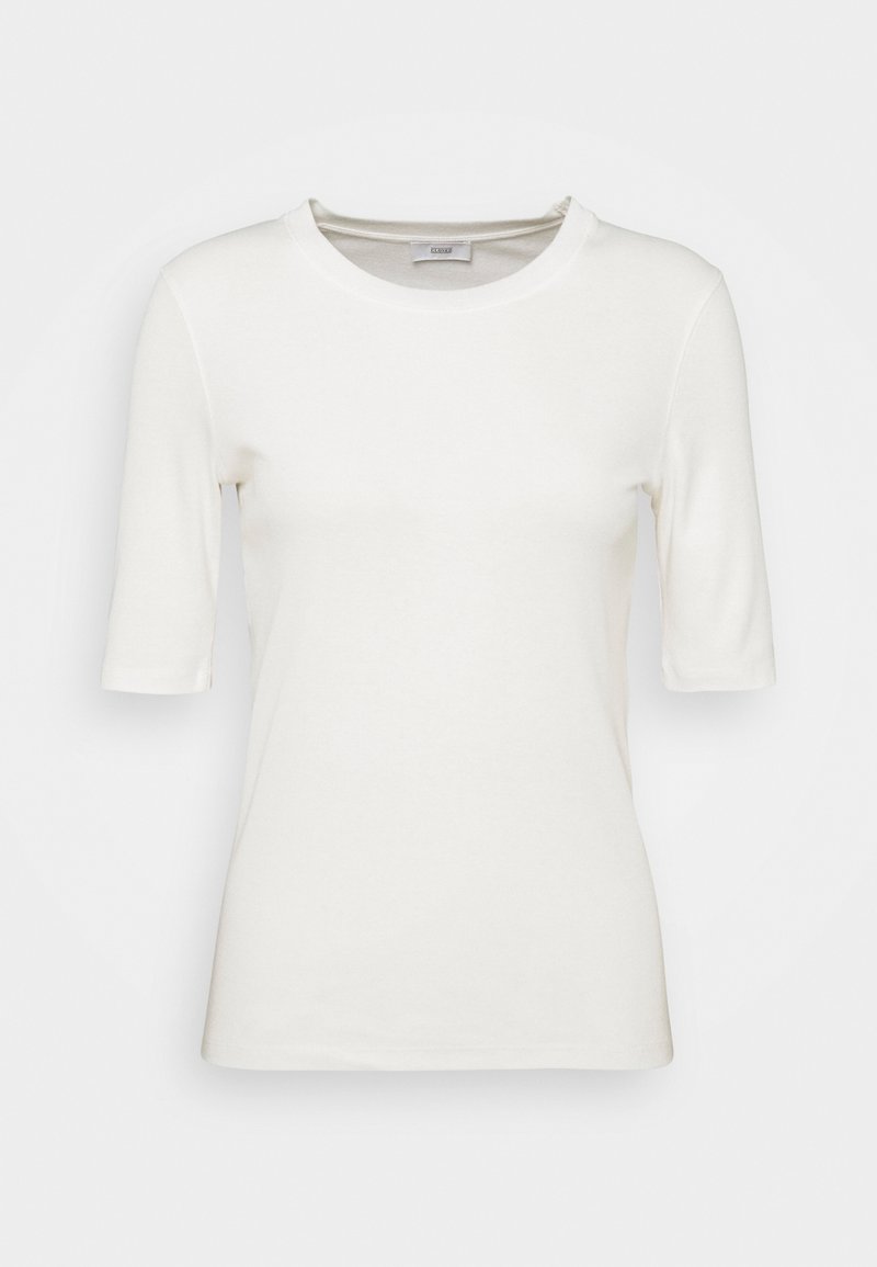 Chemise blanche unie à manches courtes avec col rond, présentée sur fond neutre.