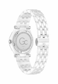 Reloj blanco con una caja octagonal de cerámica, fondo de acero inoxidable y una pulsera de eslabones blancos. Presenta un cristal de zafiro y el logotipo de la marca en la parte posterior.