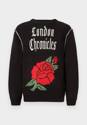 Black knitted sweater featuring "London Chronicles" text in white, with a large red rose design and green leaves on the back.