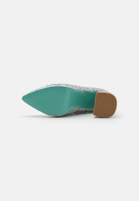 Sparkly, multicolor pointed-toe heel with a textured upper, light blue sole, and a short, tan block heel.