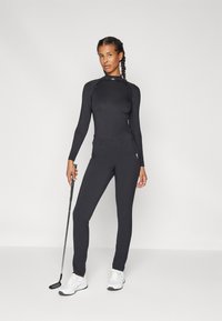 Kjus WOMEN WARM STRETCH TREGGINGS - Auduma bikses - black
