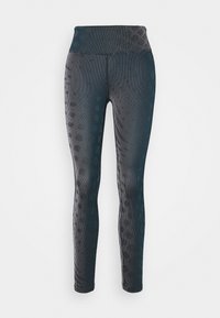 Černé legíny s vysokým pasem, s texturovaným pruhovaným vzorem a jemnými tečkami, vyrobené z pružného a prodyšného materiálu.