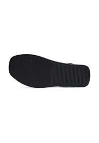 Talpa de încălțăminte din cauciuc negru, cu o suprafață netedă, având un model texturat, cu striuri pentru tracțiune și stabilitate.