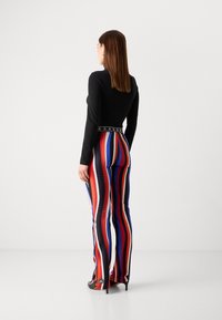 Marc Cain Leggings - Pantaloni - cranberry